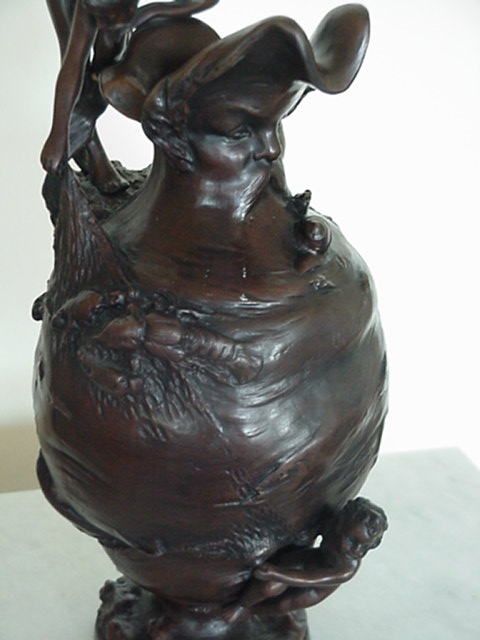 GIRL ON VASE W/ MANS FACE FISHING