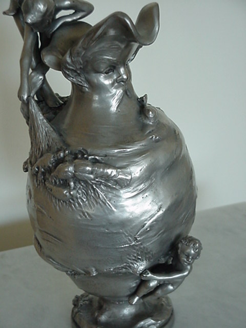 GIRL ON VASE W/ MANS FACE FISHING