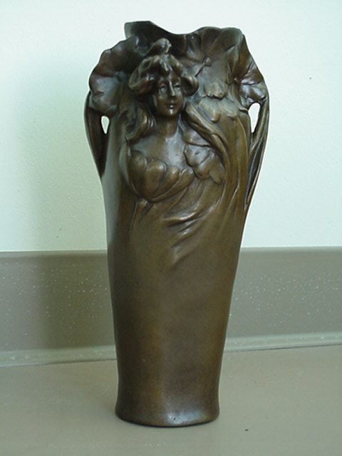 LADY FACE ON VASE IN FLOWERS