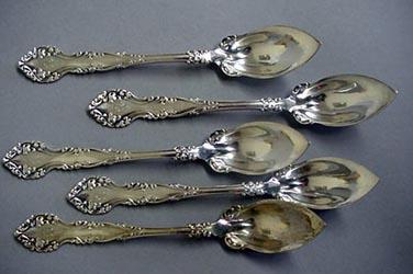 5 ornate citrus spoons sterling silver c-scrolls
