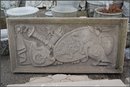 Limestone Panel of Sword , shield and helmet.