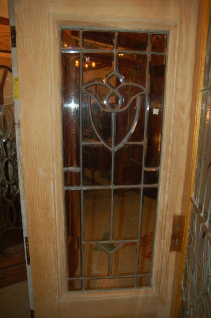 Wood entry door w/ beveled glass