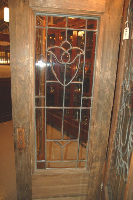 Wood entry door w/ beveled glass