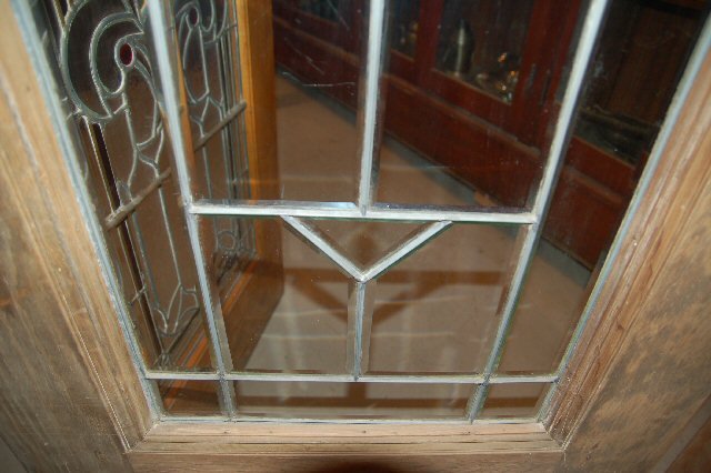Wood entry door w/ beveled glass