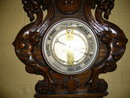 A Highly Carved French Walnut Barometer Features Winged Griffins