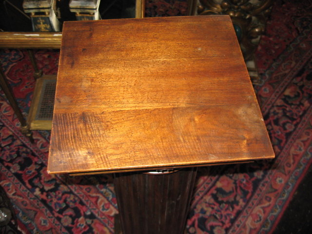 A handsome French carved walnut pedestal