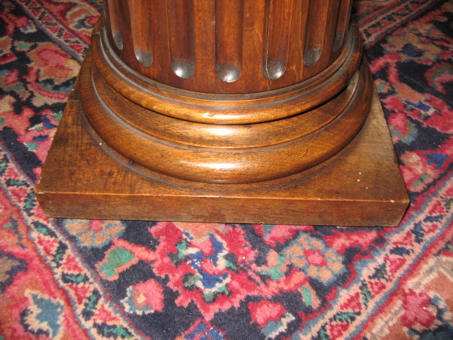 A handsome French carved walnut pedestal