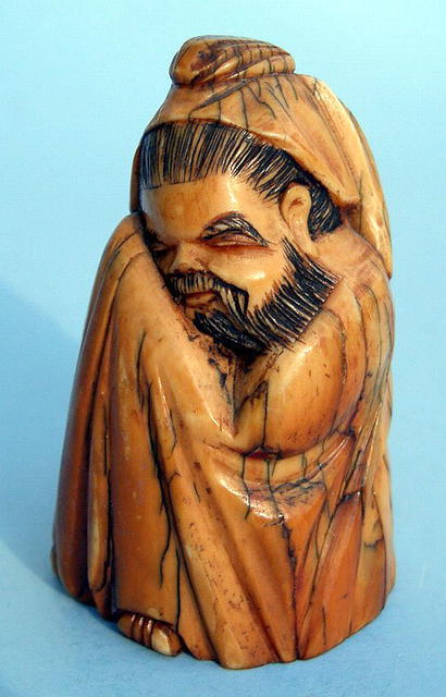 JAPANESE IVORY FIGURE OF A SEATED SCRIBE NICE