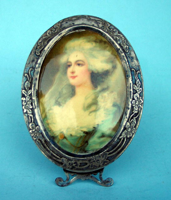 FINE STERLING AND CELLULOID PICTURE FRAME NEAT