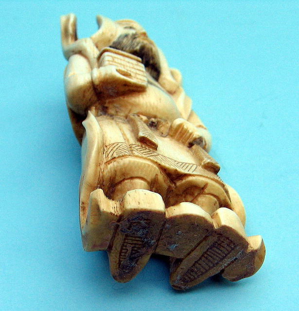 NICE CHINESE OKIMONO IVORY OF DIETY OR EMPEROR