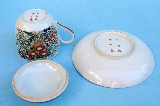 FINE MEIJI JAPANESE SATSUMA COVERED CUP AND SAUCER