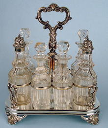 FINE ENGLISH STERLING 7 BOTTLE CASTOR SET FRAME 1861