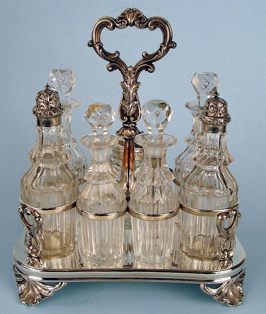 FINE ENGLISH STERLING 7 BOTTLE CASTOR SET FRAME 1861