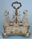 FINE ENGLISH STERLING 7 BOTTLE CASTOR SET FRAME 1861