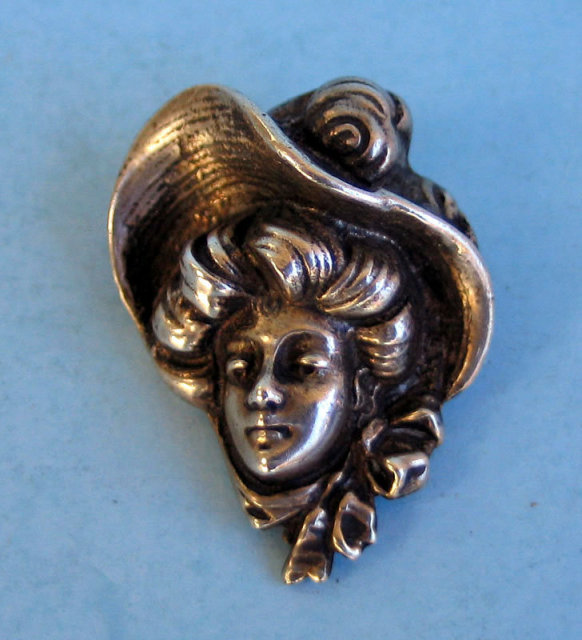 Very nice and well done silver pin or brooch of a 1900s woman with a great hat on. About 1.5