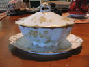 Haviland Limoges covered sauceboat with attached underplate, yellow roses
