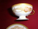 Haviland Limoges Fancy pedestal tea cup and saucer, lots of gold
