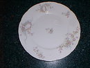 Haviland Limoges luncheon plate, wreath of pink roses w/blue scrolls