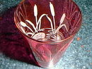 Cranberry glass tumbler with etched design