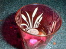 Cranberry glass tumbler with etched design
