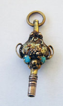 19th Century Gold Urn shaped Watch Key with Grape and Vine Decoration