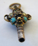 19th Century Gold Urn shaped Watch Key with Grape and Vine Decoration