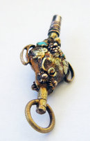 19th Century Gold Urn shaped Watch Key with Grape and Vine Decoration