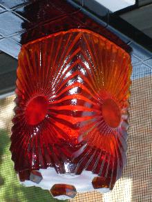 Circa 1886 most unusual RIBBED + BULLSEYE + FOOTED AMBERINA Glass toothpick holder , research indicates C.1886 Ribbed effect on outer surface, Reverse Bullseye each at different height on panels. Footed.
