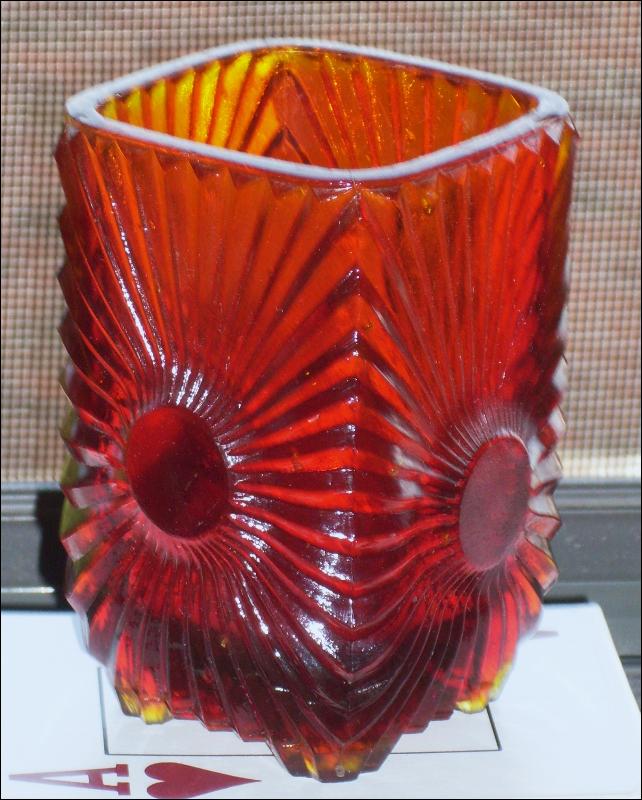 Circa 1886 most unusual RIBBED + BULLSEYE + FOOTED AMBERINA Glass toothpick holder , research indicates C.1886 Ribbed effect on outer surface, Reverse Bullseye each at different height on panels. Footed.