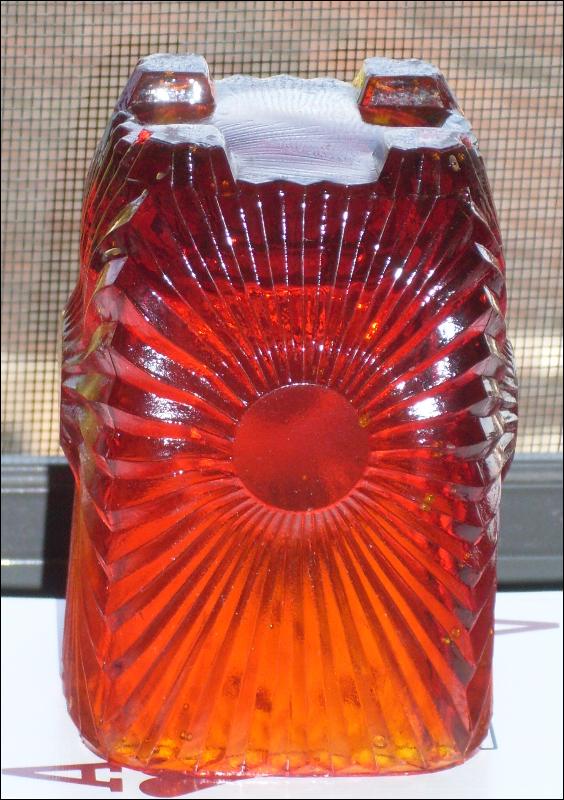 Circa 1886 most unusual RIBBED + BULLSEYE + FOOTED AMBERINA Glass toothpick holder , research indicates C.1886 Ribbed effect on outer surface, Reverse Bullseye each at different height on panels. Footed.