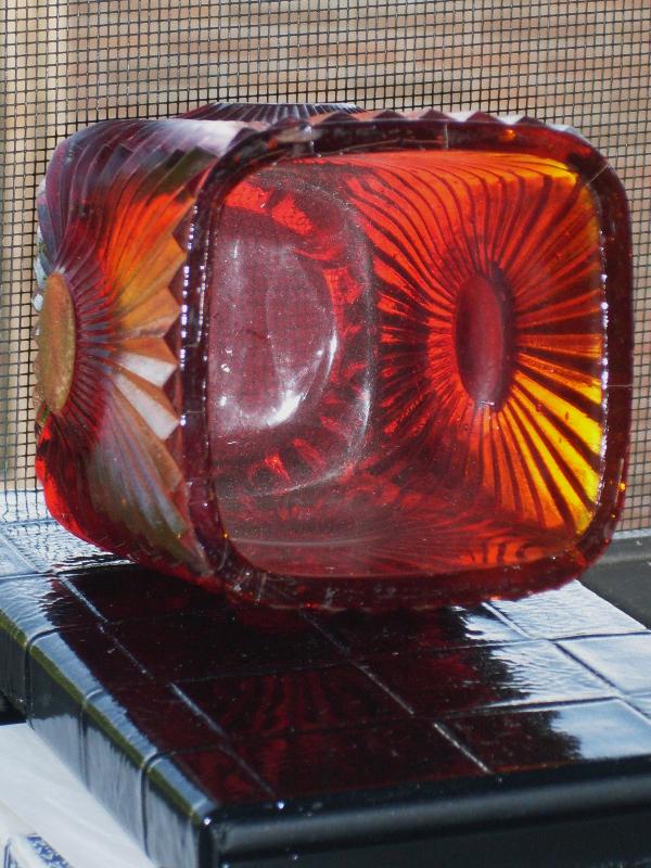 Circa 1886 most unusual RIBBED + BULLSEYE + FOOTED AMBERINA Glass toothpick holder , research indicates C.1886 Ribbed effect on outer surface, Reverse Bullseye each at different height on panels. Footed.