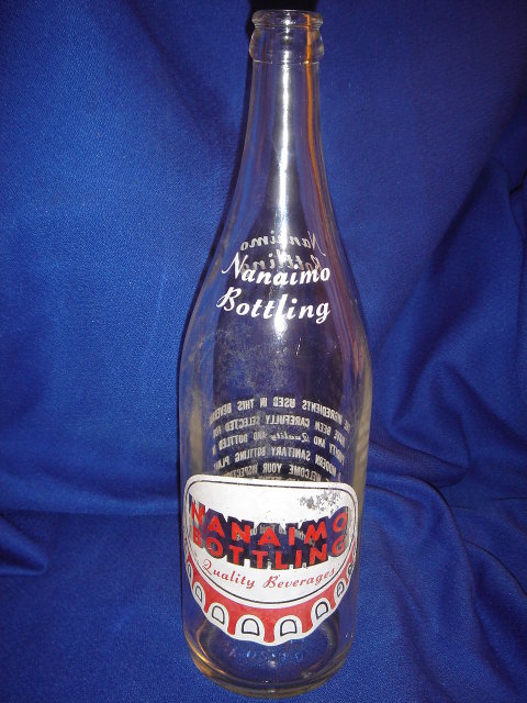 Collectible POP BOTTLE ~ LARGE 28 fl oz NANAIMO BOTTLING ~ Quality Beverages ~ 70 Mill Street Nanaimo, B.C. ~ White + Red Lettering with POP CAP Logo