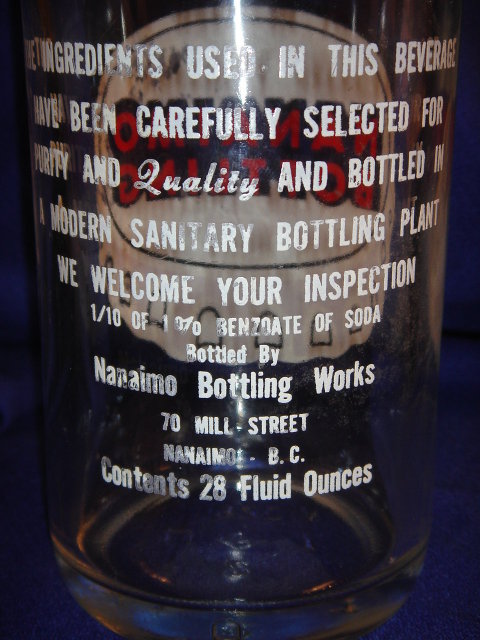 Collectible POP BOTTLE ~ LARGE 28 fl oz NANAIMO BOTTLING ~ Quality Beverages ~ 70 Mill Street Nanaimo, B.C. ~ White + Red Lettering with POP CAP Logo