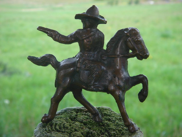 Bronze style Western Cowboy shooting a handgun while mounted on his Galloping Horse__RARE Find in Miniature. SOLID CAST FIGURE Not Hollow__Excellent Condition.