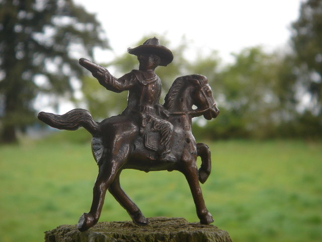Bronze style Western Cowboy shooting a handgun while mounted on his Galloping Horse__RARE Find in Miniature. SOLID CAST FIGURE Not Hollow__Excellent Condition.