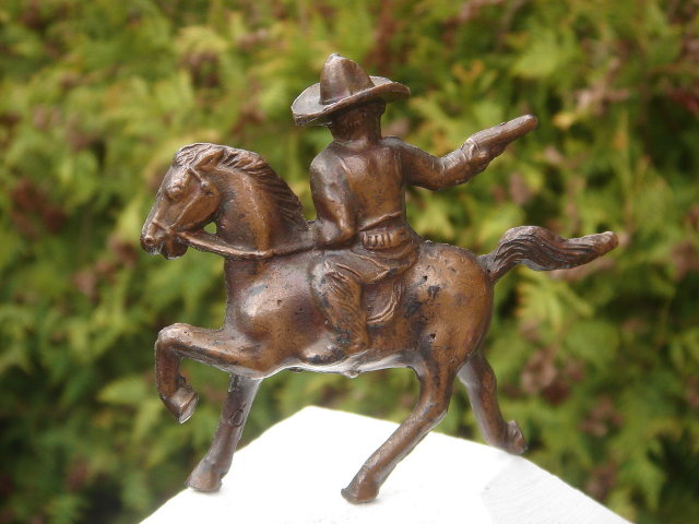 Bronze style Western Cowboy shooting a handgun while mounted on his Galloping Horse__RARE Find in Miniature. SOLID CAST FIGURE Not Hollow__Excellent Condition.