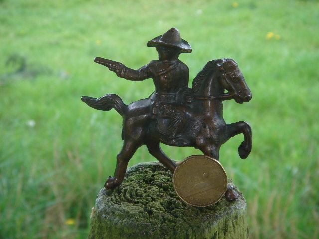 Bronze style Western Cowboy shooting a handgun while mounted on his Galloping Horse__RARE Find in Miniature. SOLID CAST FIGURE Not Hollow__Excellent Condition.