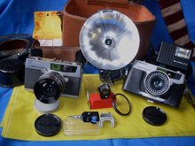 Photography Add to your Vintage Camera Collection or Camera Buffs Still Make Use __TWO _ 2 _ Petri 7s- 1963 Rangefinder Cameras CIRCLE-EYE Green System Cameras + Case & Lots of attachments