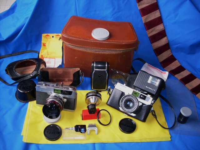 Camera Collector / Camera Buffs Still Make Use __TWO _ 2 _ Petri 7s- 1963 JAPAN Rangefinder Cameras CIRCLE-EYE Green System Cameras + Case & Lots of attachments