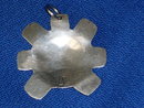old British Columbia _1st. Nations _Indian _Native Art in Sterling Silver . Sun Spirit Mask symbol pendant . The Skill of Native carver. Beautiful. Monogram signature ( N S ) Circa 1970