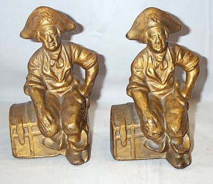 Pair Of Gilded Cast Iron Book Ends