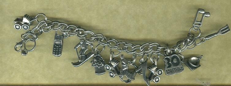 Silver Charm Bracelet w/ 14 Assorted Charms Included