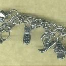 Silver Charm Bracelet w/ 14 Assorted Charms Included