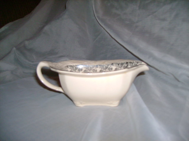 Antique Creamer with Sterling Silver Design