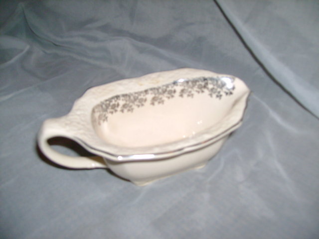 Antique Creamer with Sterling Silver Design