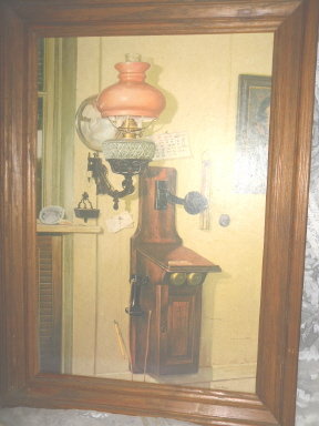 Vintage Picture of Antique Wooden Telephone & Antique Oil Lamp