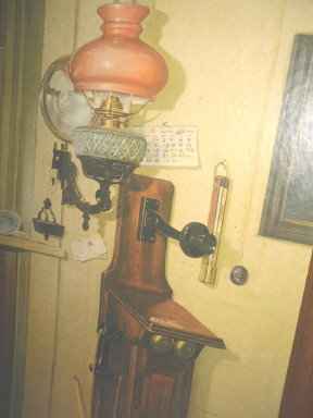 Vintage Picture of Antique Wooden Telephone & Antique Oil Lamp