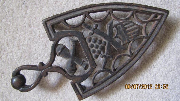 Cast Iron Trivet Featuring Militaria
