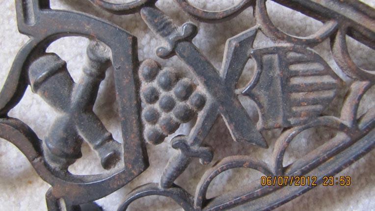 Cast Iron Trivet Featuring Militaria