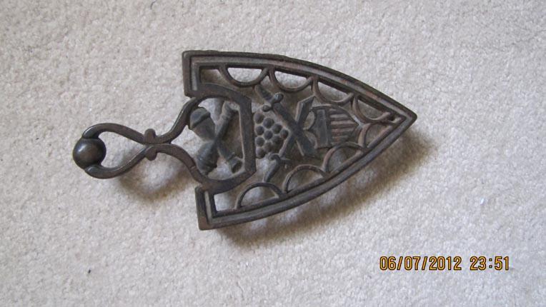Cast Iron Trivet Featuring Militaria